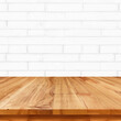 © Rafa - Wooden table with white bricks background