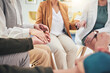 © Azee/peopleimages.com - Business people, holding hands and circle with praying, support and faith for worship, gratitude and praise, Men, women and sitting together for meditation, mindfulness or religion for mental health