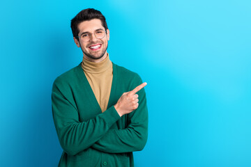 Sticker - Photo of cheerful successful realtor man beaming smile direct finger empty space ad isolated on blue color background