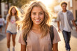 © anandart - portrait of a beautiful happy white young woman smiling with friends, rollerblading, in a park at sunset, in the city on a beautiful sunny summer day