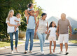 Happy, big family and walking outdoor in neighbourhood street together for fun, bonding or activity with kids, parents and grandparents. Summer, vacation or grandchildren on holiday or adventure
