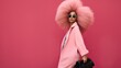 Stylish african american woman wearing pink cloth isolated on pink, fashion doll, 
