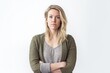 © Leon Waltz - Lifestyle portrait photography of a woman in her 30s with a somber and deeply sad expression due to major depression wearing a chic cardigan against a white background