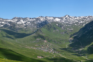 Snowy mountains and white clouds in the blue sky. Kabahor ( Göl plateau ) mountains in Turkey. Kackar Mountains. Rize, Türkiye.