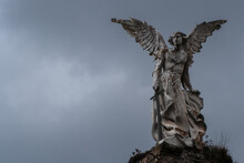 Ancient Victorian Statue Of Destroyer Angel At A Graveyard With Dark Sky. Statue Of Abbadon From Josep Limona 1895