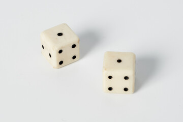 Two white dice on a white isolated background