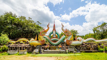 Ubon Ratchathani, THAILAND - August 8, 2023: Buddhist Travel Glowing Serpent Statue With Sunlight At Wat Pa Phu Pang Temple, Si Chiang Mai District, Ubon Ratchathani Province, Thailand.
