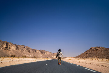 Wall Mural - view in the Sahara desert of Tadrart rouge tassili najer in Djanet City  ,Algeria.colorful orange sand, rocky mountains