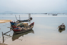 Small Boats Anchored In A Vietnamese Lagoon