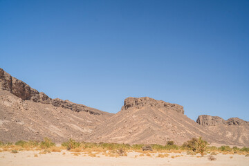 Sticker - view in the Sahara desert of Tadrart rouge tassili najer in Djanet City  ,Algeria.colorful orange sand, rocky mountains