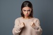 © Ameer - Portrait of angry dissatisfied European young female frowning her face, holding fists in front of her, ready to fight or defend herself. aggressive, emotional female, feeling insulted