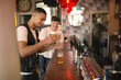 © Connect Images - Young man with beer at bar