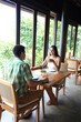 © Connect Images - Young couple sitting at table with salad