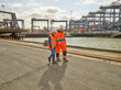 © Connect Images - Dock workers walking at Port of Felixstowe, England