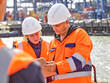 © Connect Images - Dock workers with digital tablet at Port of Felixstowe, England