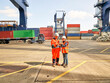 © Connect Images - Dock workers using tablet PC at Port of Felixstowe, England