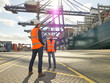 © Connect Images - Female dock worker standing with male colleague, Felixstowe, England.