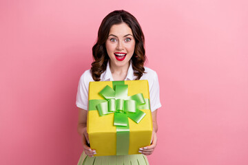 Canvas Print - Photo of cheerful impressed lady wear white blouse getting yellow big gift box isolated pink color background