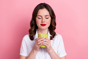 Sticker - Photo of dreamy cute young girl dressed white top drinking coffee isolated pink color background