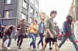 © Connect Images - Teenage friends walking along street