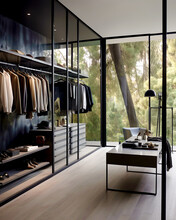 Modern Minimalist Men Walk In Wardrobe With Clothes Hanging On Rods, Shelves And Drawers. Dressing Room With Space For Storing And Organizing Accessories. Interior Design Of Luxury Walk In Closet.
