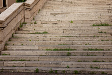 Old Steps In Rome Italy With Grass Growing Through The Many Cracks