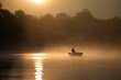 © Oleksandr Kozak - A fisherman fishing in a boat on a lake with fog during sunrise