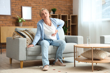 Poster - Mature woman having heart attack at home