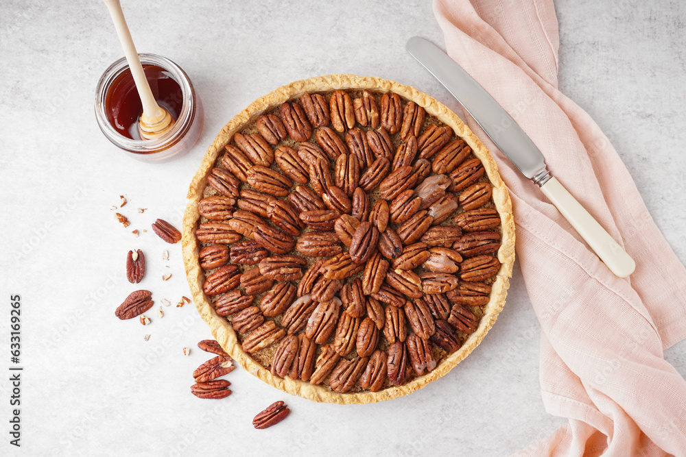 Tasty pecan pie on light background