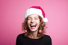 Happy Woman Radiates Holiday Cheer As She Wears A Christmas Red Santa Claus Hat, Adding A Festive Touch To Her Joyful Spirit Isolated Pink Background