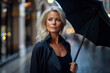 © Kalim - AI generated image of mature attractive female with umbrella