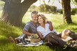 © Kalim - AI generated image of mature couple on picnic