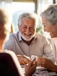 © Kalim - AI generated image of seniors playing cards in home