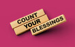 Wooden blocks with count your blessings word on colorful isolated background 3d illustration