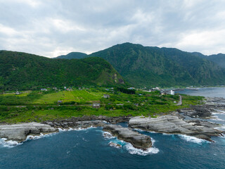 Sticker - Drone fly over Taiwan Hualien rice field over the sea in Fengbin Township, Shitiping Coastal Stone Step Plain