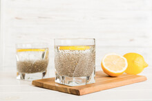 Healthy Breakfast Or Morning With Chia Seeds And Lemon On Table Background, Vegetarian Food, Diet And Health Concept. Chia Pudding With Lemon