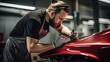 Auto body repair specialist focuses on repairing a dent on the car's fender, showcasing their expertise and commitment to impeccable restoration. Generated by AI.