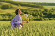 Elderly woman in stylish clothing relaxing in a lush meadow, embodying the fulfilling experiences offered in senior communities