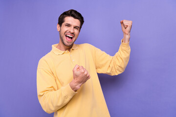 Sticker - Photo of overjoyed satisfied person raise fists triumph accomplishment scream yeah isolated on violet color background