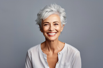 Wall Mural - AI generated image of mature senior woman on grey background in studio