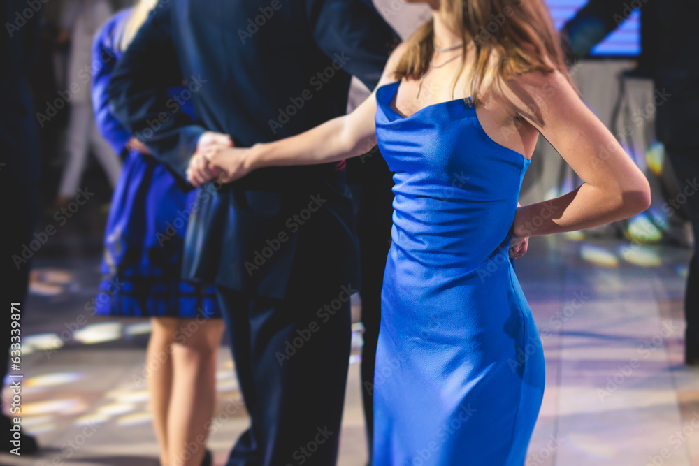 High school graduates dancing waltz and classical ball dance in dresses ...