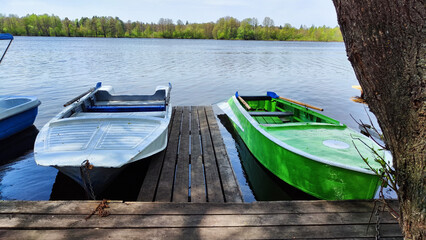 Wall Mural - Old boats on water of river or lake in autumn, sprin, summer season. Landscape with water and boat