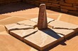 sandstone sundial casting a sharp shadow at midday