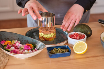 Wall Mural - Cook preparing tartar in kitchen