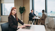 © NewSaetiew - Portrait of businesswoman discussion and meeting with computer in office. Smiling beautiful female sitting in front of workplace. Using labtop during a meeting.