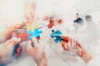© alphaspirit - Team working background with puzzles. Double exposure effects
