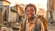African kid with backpack is looking to the camera and walking to school on the dusty street. Back to school. 