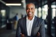 © CojanAI - Portrait of a middle aged african american businessman looking at the camera in an office