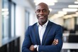 © CojanAI - Portait of a middle aged businessman of african ethnicity in an office looking at camera