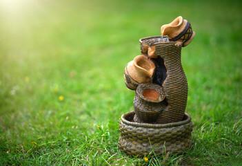 Ceramic garden fountain with vases.Sounds of water to calm down.Relax in the garden in the fresh air.Garden sculpture.